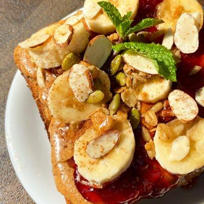 Try our ABJ Toast--almond butter & strawberry preserves, banana slices (or apples) & sprinkled with granola, almond slices & cinnamon.