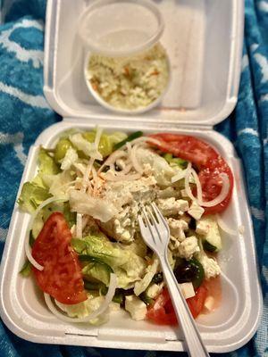 Greek salad with a side of cole slaw