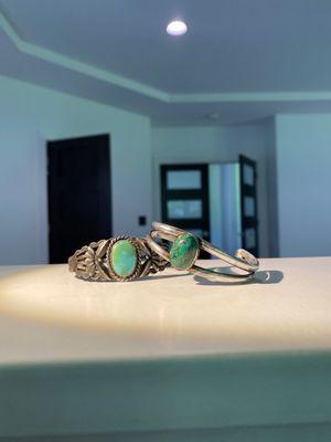 Two authentic Navajo and turquoise cuffs.