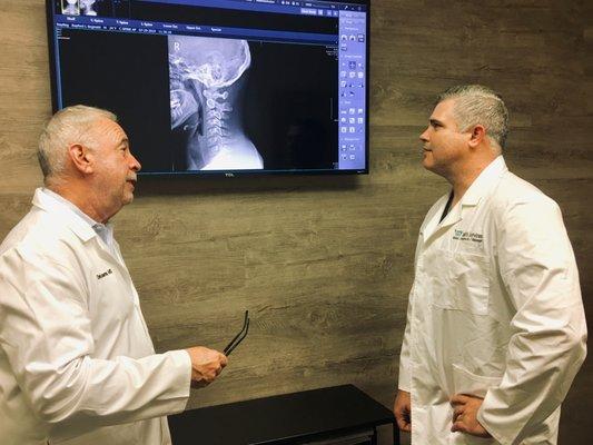 Dr. Forbes and Dr. Cooperman discussing X-rays.