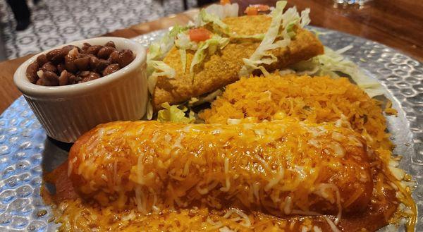 Combination chicken enchilada and hard shelled beef taco with whole pinto beans.