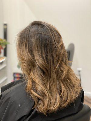 Blended highlights in medium brown Asian hair.  Caramel light brown highlights and medium length with layers by Christine Choi