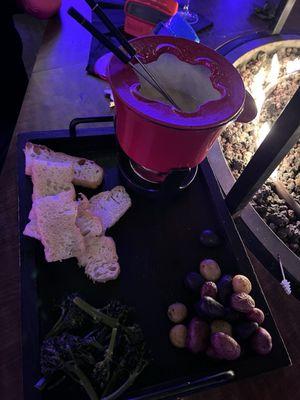 The 2025 Fireside Fondue and accoutrements: broccolini, bread and potatoes (too many carbs)