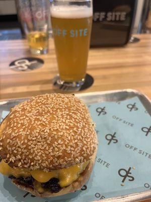 Burger with juicy melted cheese and a cold beer