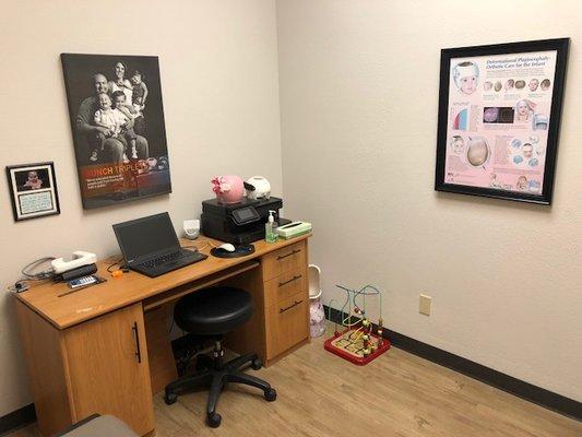 Patient room where cranial remolding bands are scanned and adjusted complete with toys to keep the little ones entertained.