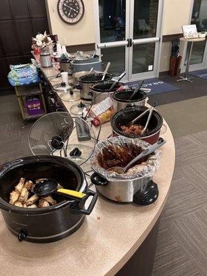 Having our potluck dinner- so much  great food!  This is just the crockpots!!!