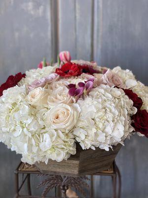 Custom made arrangement in a wooden bowl