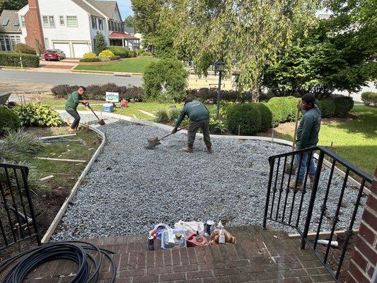 Setting the molds and gravel base.