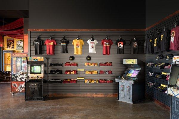 Alamo Drafthouse Staten Island lobby with arcade games and exclusive merchandise