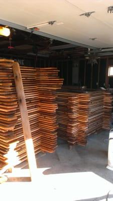 Freshly milled western red cedar drying out while it waits to be turned into our new fence!