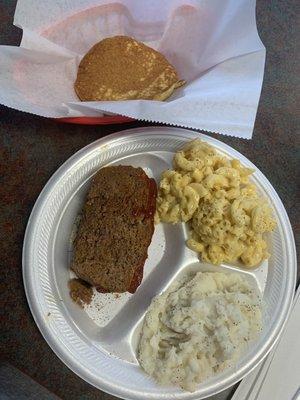 Meatloaf mashed potatoes and macaroni and cheese with cornbread.