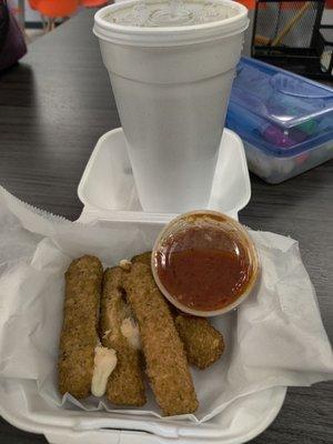 Four badly cooked mozzarella sticks