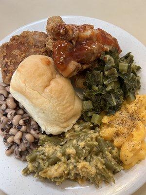 Green bean casserole, macaroni and cheese, collard greens, pork ribs, roll,  black eyed peas, fried catfish, fried chicken