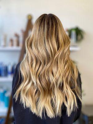 Long layers, beachy waves 
Sun kissed balayage