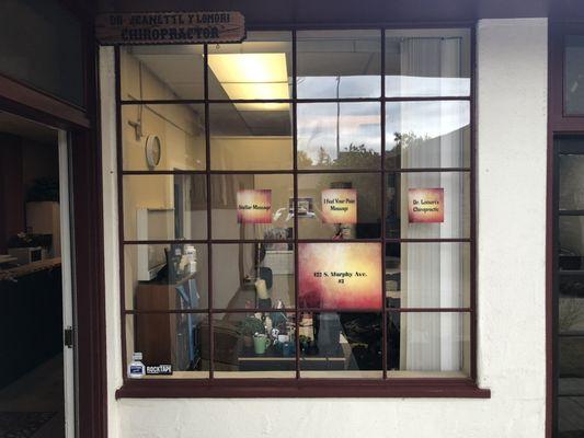 Window with signs for office at 422 south Murphy avenue