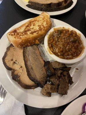 3 meat combo, brisket, turkey, burnt ends with smoked baked beans.