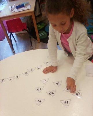 My daughter working on number identification in Mr. Armando's class