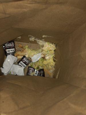 The inside of my bag. The remains of my cheesy Gordita