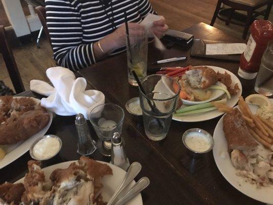 Beer battered fish was mostly batter. Waitress brought the bill to the table, never cleared appetizer, bottles, or dinner.