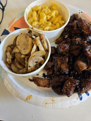 Burnt ends with Mac and Cheese, fried potatoes