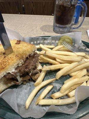 The Fat Bob 1/2 lb burger served with mushroom and onions and mozzarella  On a crispy fresh hot garlic bread and fresh French fries!