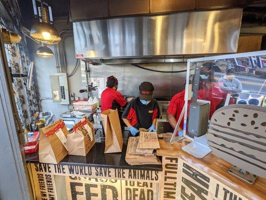 Inside. Order pickup counter. Open kitchen. It's a small place.