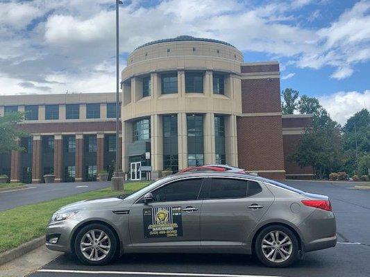 Stephanie's car with A-1 Affordable Bail Bonds of Martinsville, VA car magnets parked in front of the Henry County courthouse