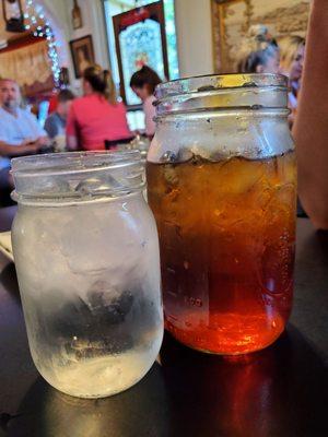 Sweet tea next to water to show how big the glass is