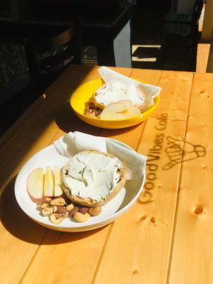 Raisin Bagel with Cream Cheese, side of fruit and nuts.