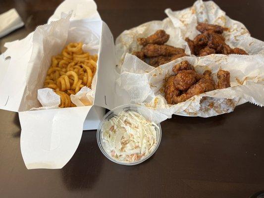 Curly fries, coleslaw, 24-piece wings in 3 different flavors