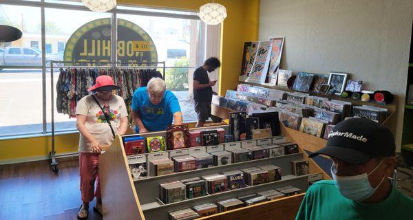 Nob Hill Music customers perusing CD sales items