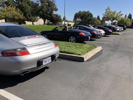 Some P cars casually lined up outside his shop. Looks like a Porsche car show!