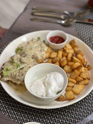 Special for the Day: Biscuit and gravy with poached eggs and potatoes.