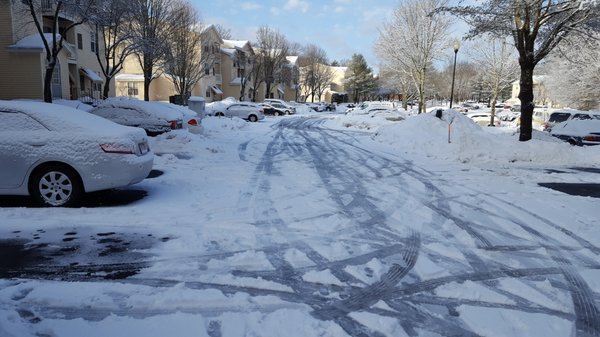 Snow covering ice in the untreated parking lot, Feb 16, 2017