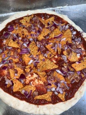 Ordered a Dorito pizza with bacon and red onions