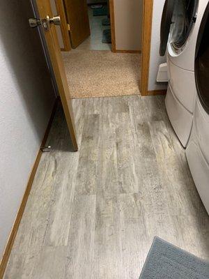 Luxury vinyl plank flooring installed in my laundry room by Guy with 701 Handyman