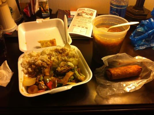 Beef with vegetables, Hot and sour soup, and an eggroll.