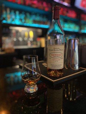 Pappy van winkle 12 yr, 90 proof about $90/pour   They also have Pappy 10yr, 107 proof about $60/pour