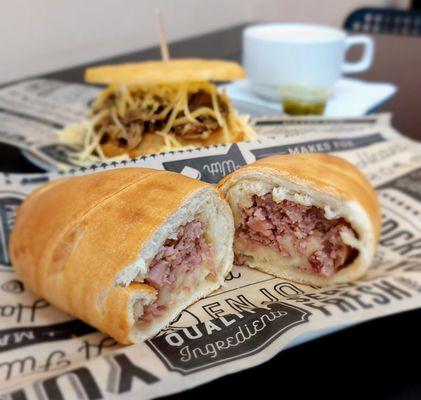 Hamrolls with shredded beef arepa in the background