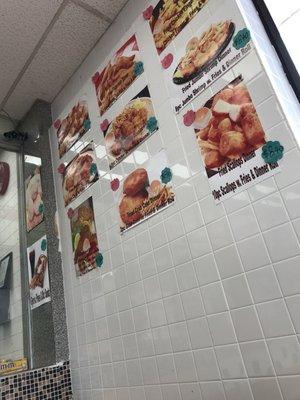 Menu items posted on the wall