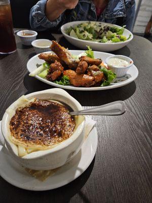 Onion soup and wings were good. Apple salad was a decent portion  !