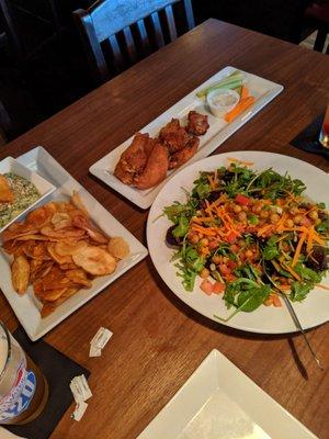 Wings, spinach and artichoke dip, and chopped salad