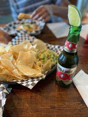 Chunky fresh made guacamole and chips with a beer!