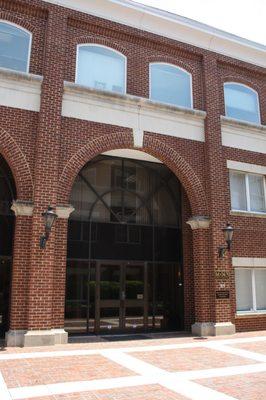 Building entrance is located in the courtyard in the middle of the office building complex.