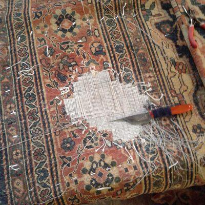 Repairing a hole on an antique Persian Sarouk Feraghan rug