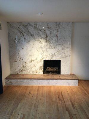 Granite slab over brick fireplace surround