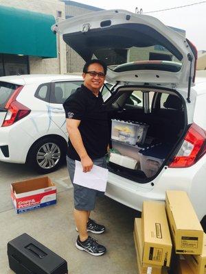 Service technician, Joseph, stocking up on supplies to keep your rental running smoothly.