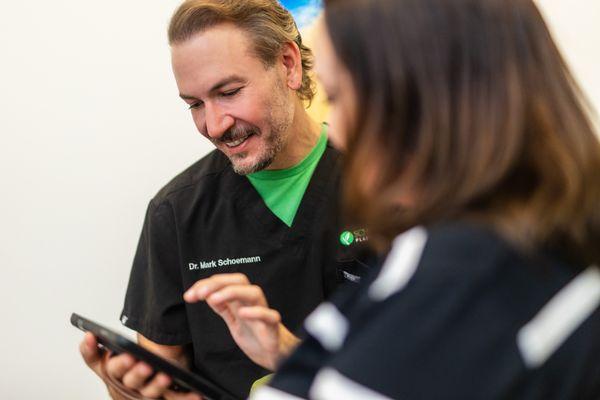 Dr. Schoemann interacting with a patient, working one-on-one with patients to ensure their specific goals are met.