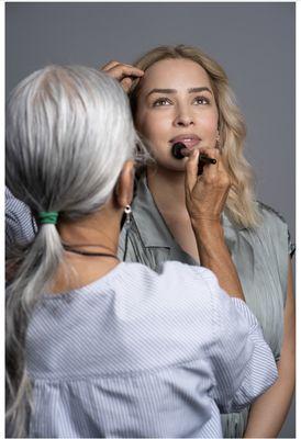 Helen touching up between shots