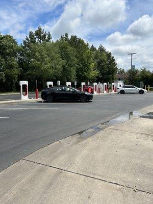 Tesla superchargers behind the building.